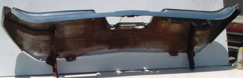 This is an original rear bumper, emblem, brackets, rubber trim for a 