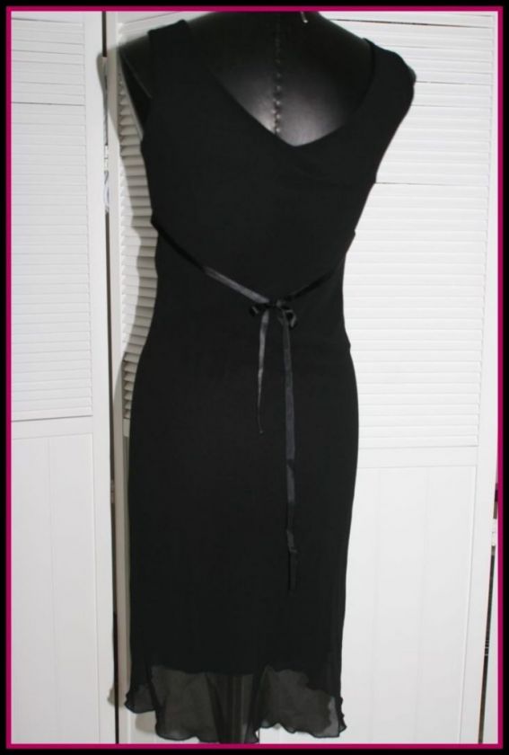   Empire waistline flares to hemline. Fully lined, no buttons or zips