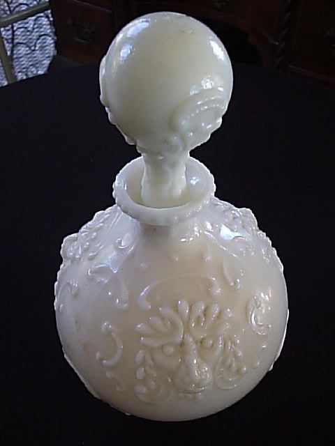 Antique Victorian Milk Glass Jug Bottle has stopper Lion Heads 9 1/2 